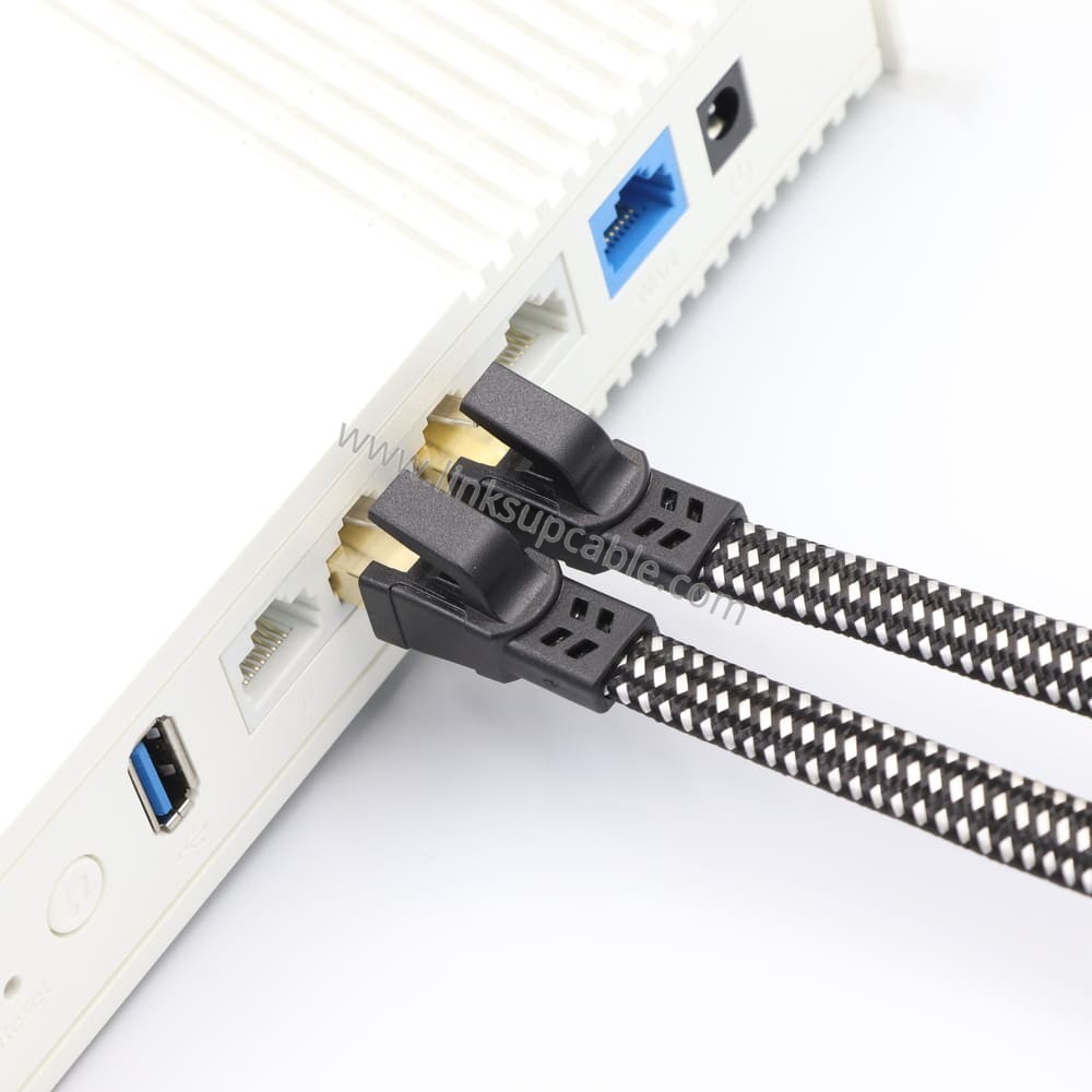 Cat8 Flat Ethernet Patch Cable — 40Gbps 2000MHz S/FTP Shielded RJ45 Cord 1 Cat8 flat Ethernet cable close-up showing gold-plated shielded RJ45 connectors with snagless latch guard